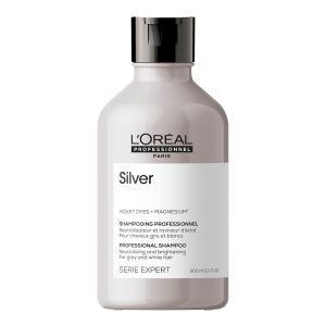 Champú Silver para cabello blanco y gris. Neutraliza tonos amarillentos y perfecciona el color. Suavidad y brillo con Gloss Protect System.